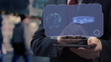 İşadamı hologram robot elektrikli süpürge kullanıyor.