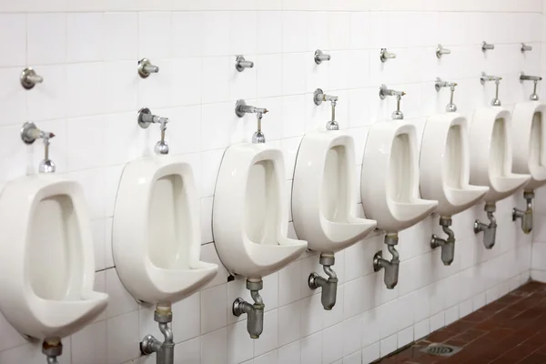 Urinals in public restroom — Stock Photo, Image