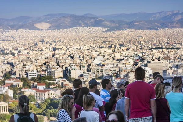 Tourists watching panorama of Athens in Greece