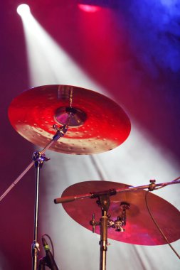 Drum plates on stage clipart