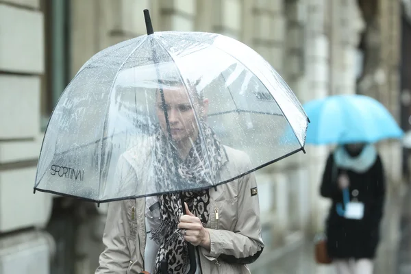 Woman with transparent umbrella on street — Stock Photo, Image