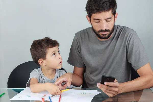 Father using smartphone ignoring his son — Stock Photo, Image