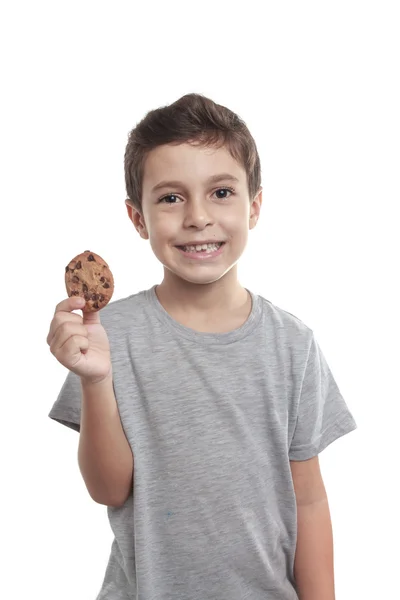 Pequeño niño comiendo galletas de chocolate —  Fotos de Stock