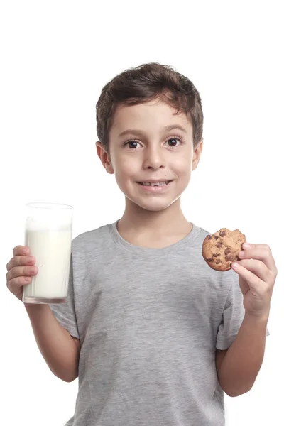 Little boy eating chocolate chip cookie — Stock Photo, Image