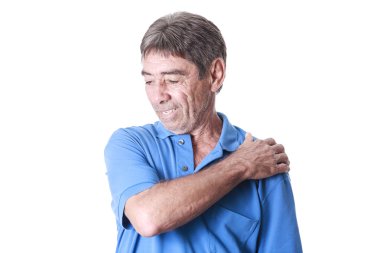 Portrait of elderly man suffering from shoulder pain clipart