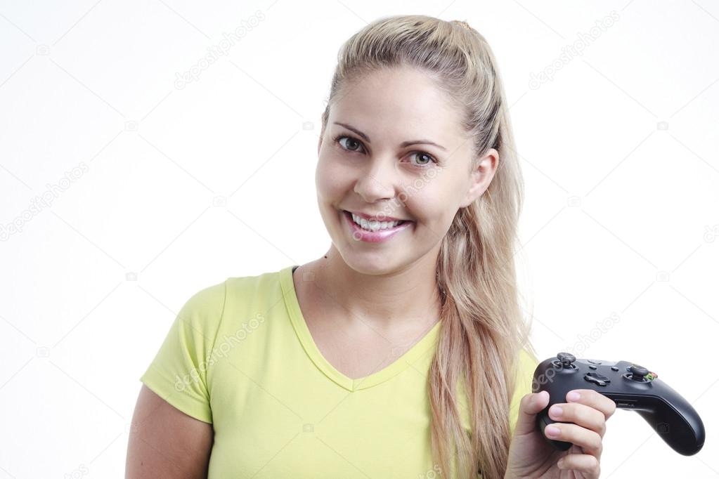 Young woman playing video game with wireless joystick