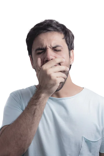 Joven bostezando con la mano en la cara — Foto de Stock