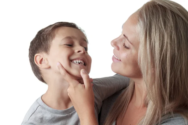 Mother looking at son's milk tooth — Stock Photo, Image