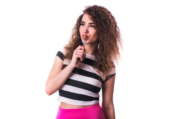 Curly woman holding lolly pop isolated on white — Stock Photo, Image