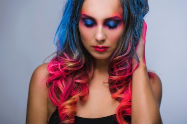 Beautiful make up, hard colors red and blue , studio 