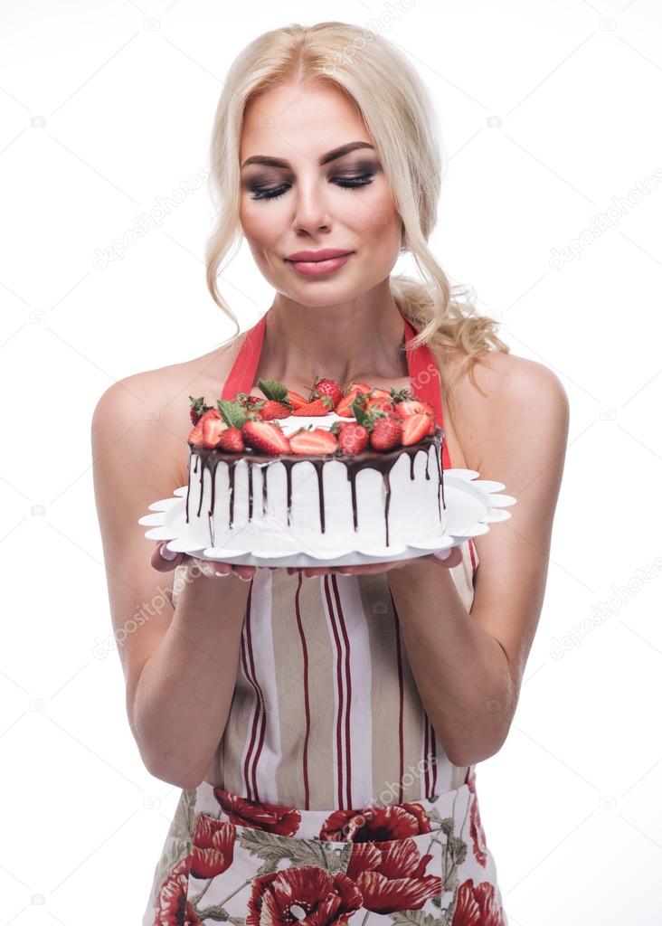 woman eating a fruit cake