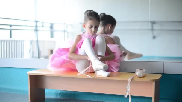 little ballerina in pointes  in the ballet hall