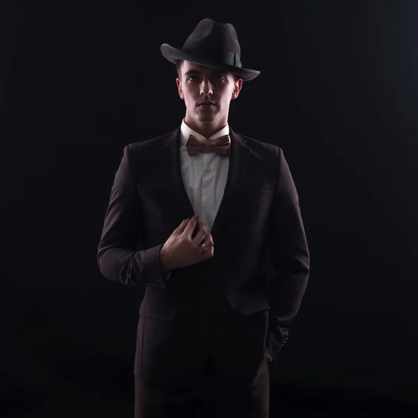 Portrait of a man in the black hat with bowtie — Stock Photo, Image