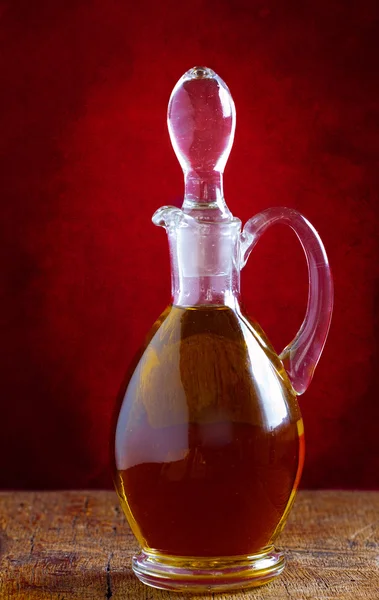 Glass carafe with olive oil — Stock Photo, Image