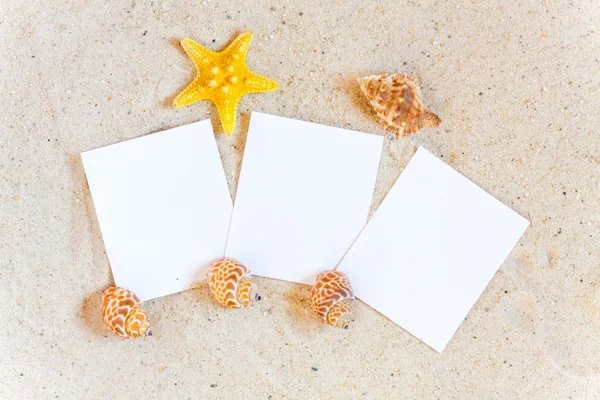 Three blank instant pictures in the Sand — Stock Photo, Image