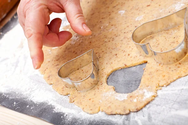 Cut out cookies in heart shape — Stock Photo, Image