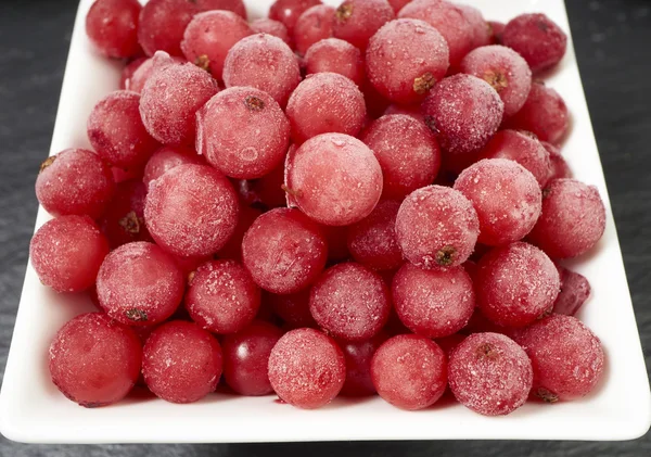 Top view of frozen currants in bowl — Stock Photo, Image