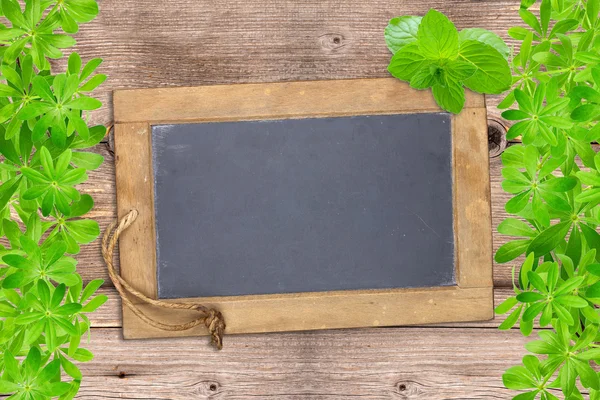 Slate board framed with woodruff — Stock Photo, Image