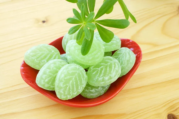 Woodruff and Candies in porcelain dish — Stock Photo, Image