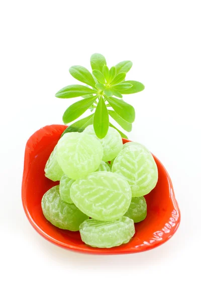 Woodruff and Candies in porcelain dish — Stock Photo, Image