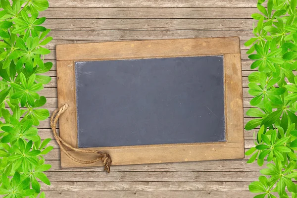 Slate board framed with woodruff — Stock Photo, Image