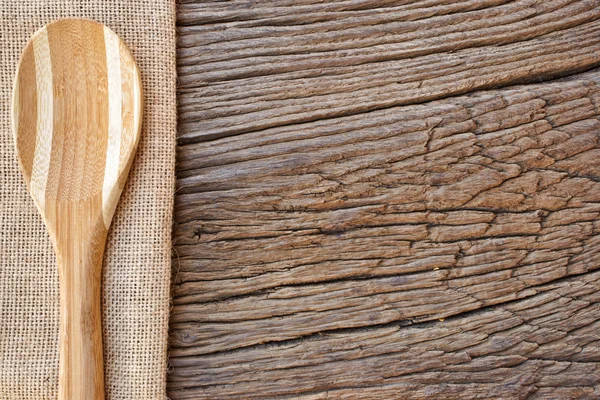 Cooking Spoon on jute fabric — Stock Photo, Image