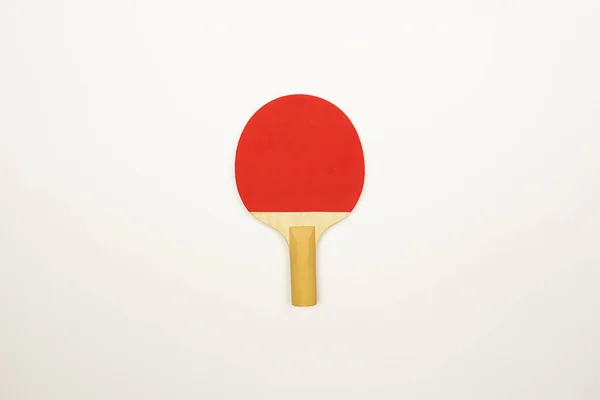 A red table tennis racket is ready for the ping-pong competitions.