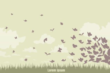 Yeşil manzara üzerinde uçan kelebekler