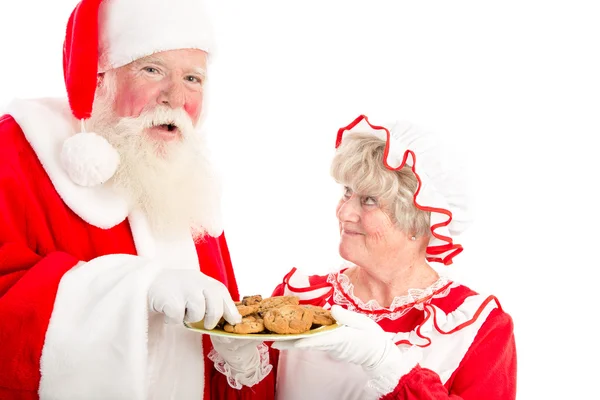 Santa lacht en neemt cookie — Stockfoto