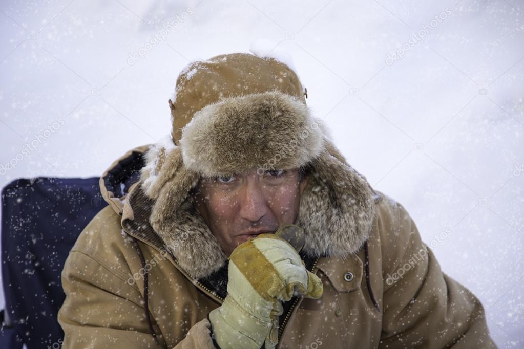 Man bundled up in sub zero winter weather