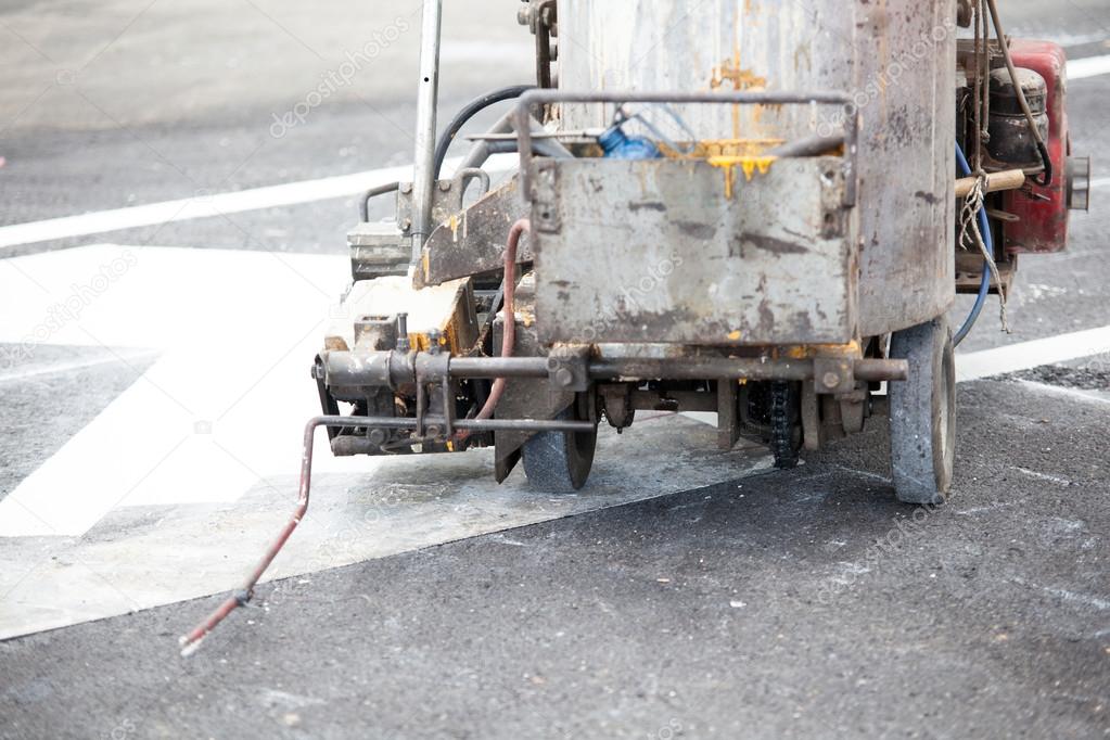 spray marking machine during road construction works