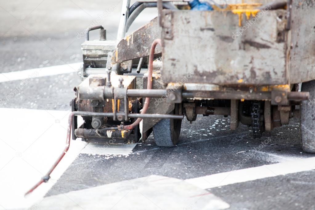 spray marking machine during road construction works