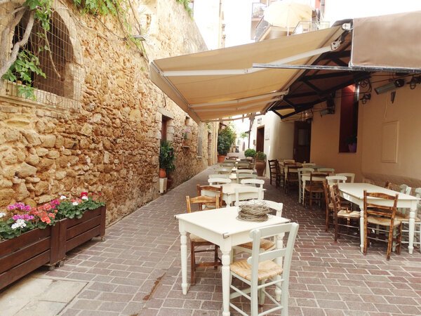 traditional street amoung bougainvillaea in chanya city Greece 