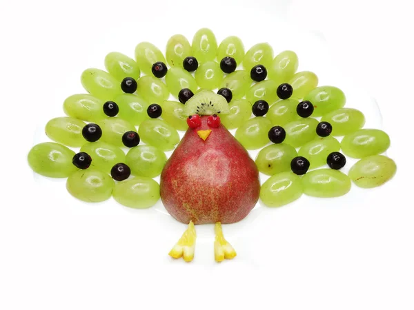 Creative fruit child dessert peacock bird form — Stock Photo, Image