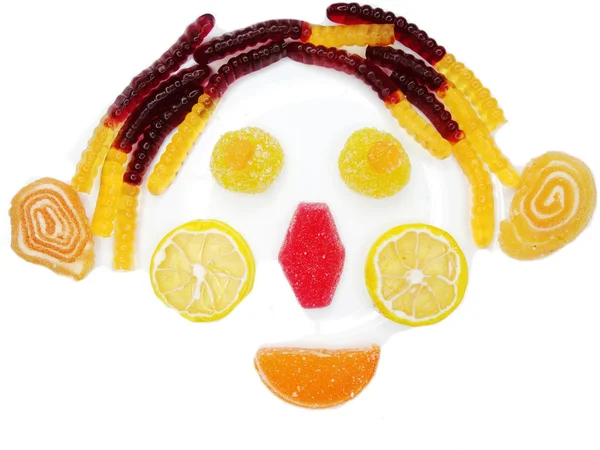 Creative marmalade fruit jelly sweet food clown face form — Stock Photo, Image