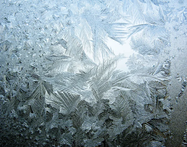 Copos de nieve hielo sobre vidrio textura abstracta fondo — Foto de Stock