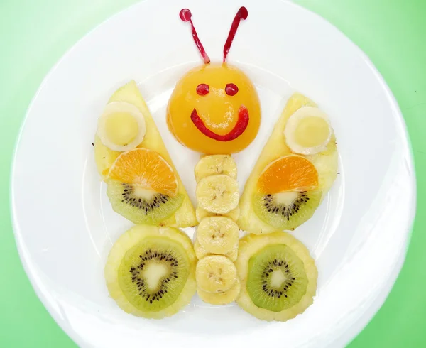 Creative fruit child dessert butterfly form — Stock Photo, Image