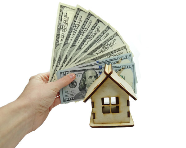 house miniature money in hand savings concept