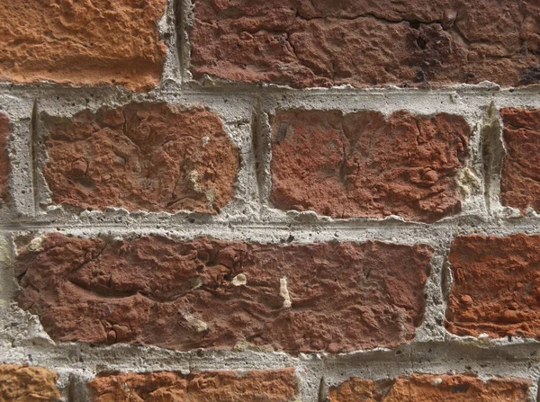 Antique brickwork on the walls of the house.