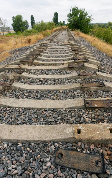 the old, non-working railway with missing railways goes beyond the horizon
