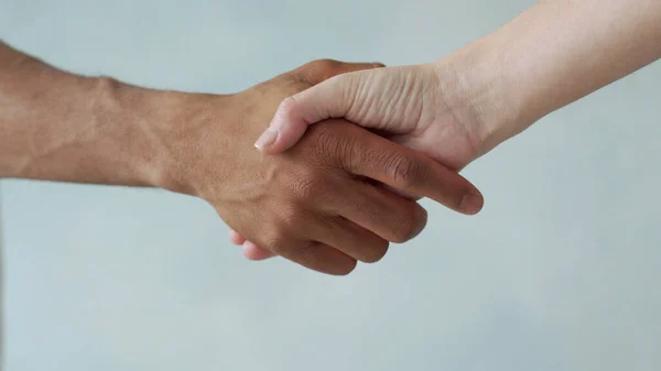 White and black hand connect. Anti-racism. Stop racism, all people are equal. Friendship of Peoples. Black lives matter