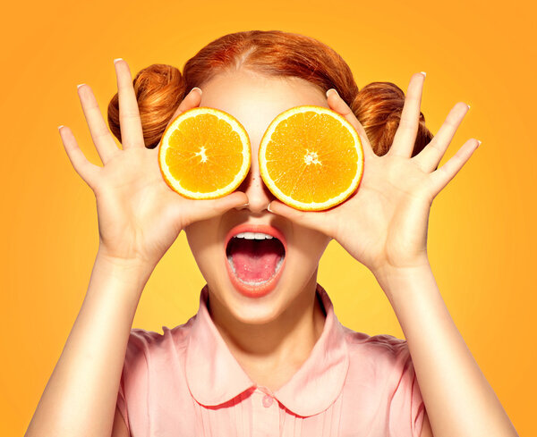 model girl takes juicy oranges