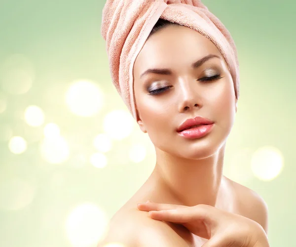 Girl after bath touching her face Royalty Free Stock Photos