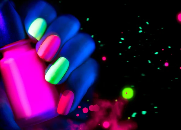 Model woman nails in neon light — Stock Photo, Image