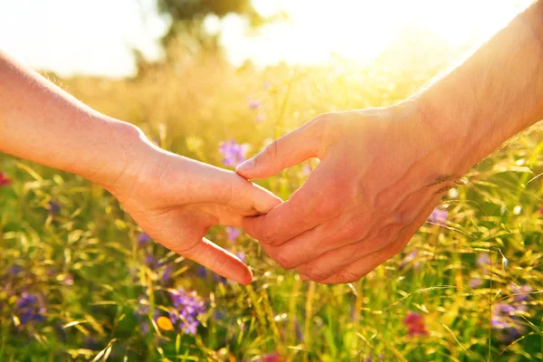 Couple taking hands — Stock Photo, Image