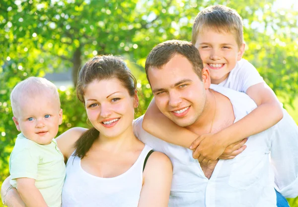 Happy young family with two children Stock Photo