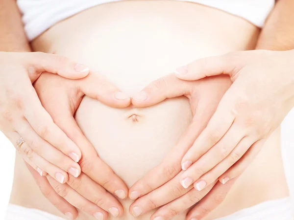 Mãos na barriga grávida — Fotografia de Stock