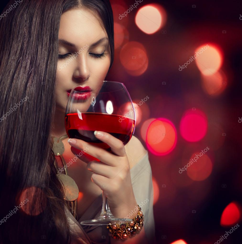 Woman drinking red wine Stock Photo by ©Subbotina 52274225