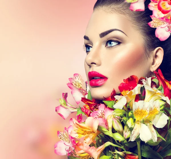 Girl with colorful flowers — Stock Photo, Image