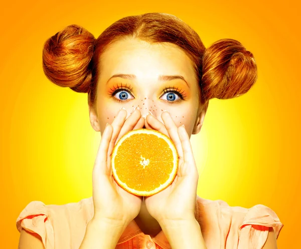 Girl takes juicy orange. — Stock Photo, Image